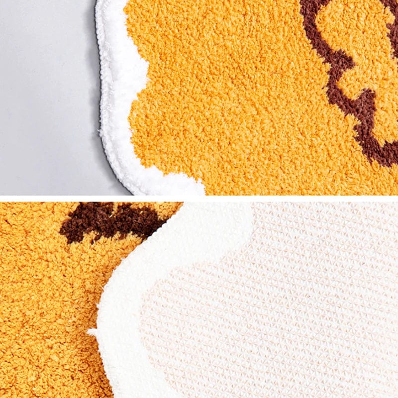 Fish-themed bath mat with plush texture and non-slip backing.