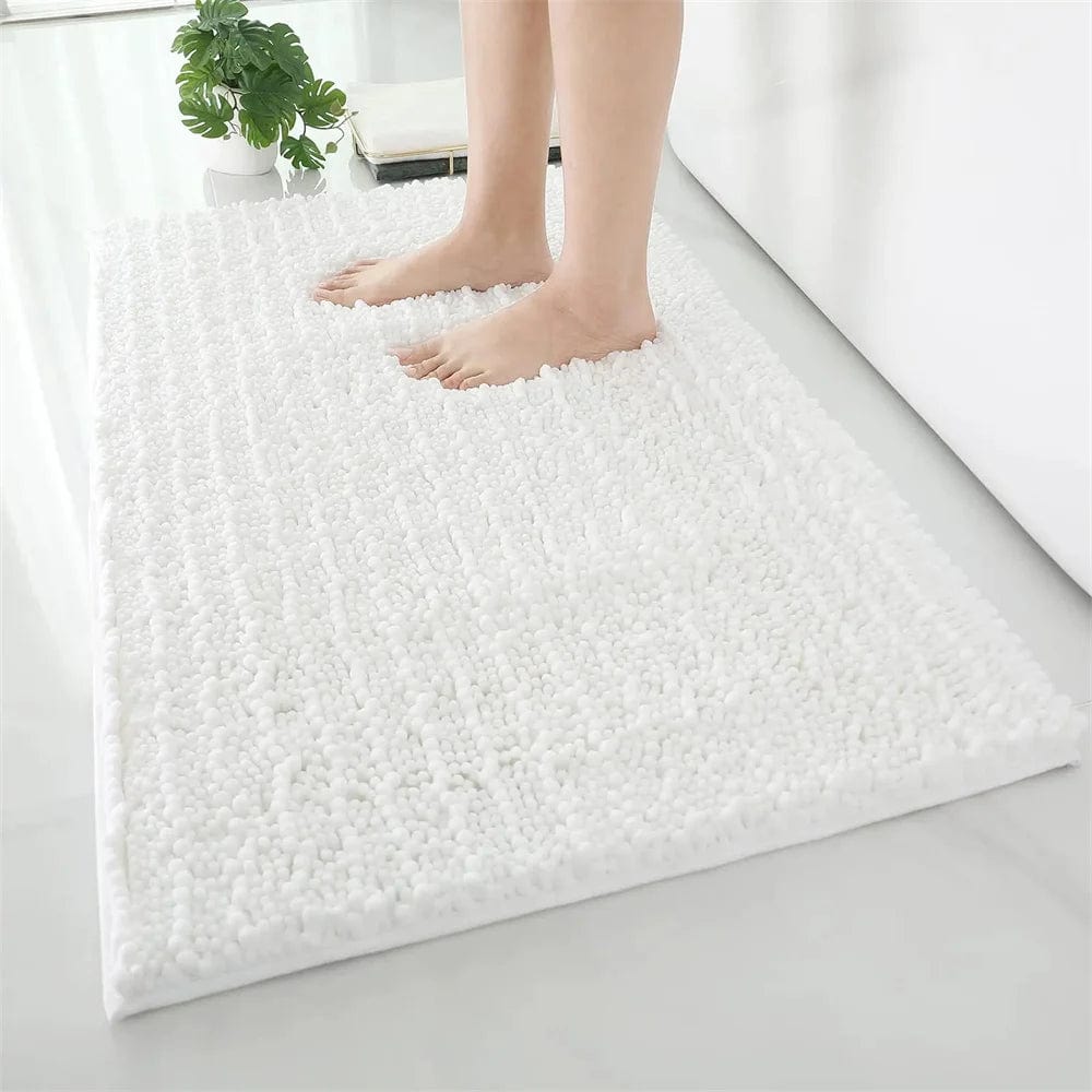 Fluffy white bath mat with bare feet for comfort and style.