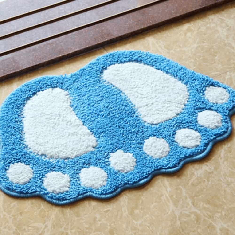 Foot shaped bath mat blue white plush design.