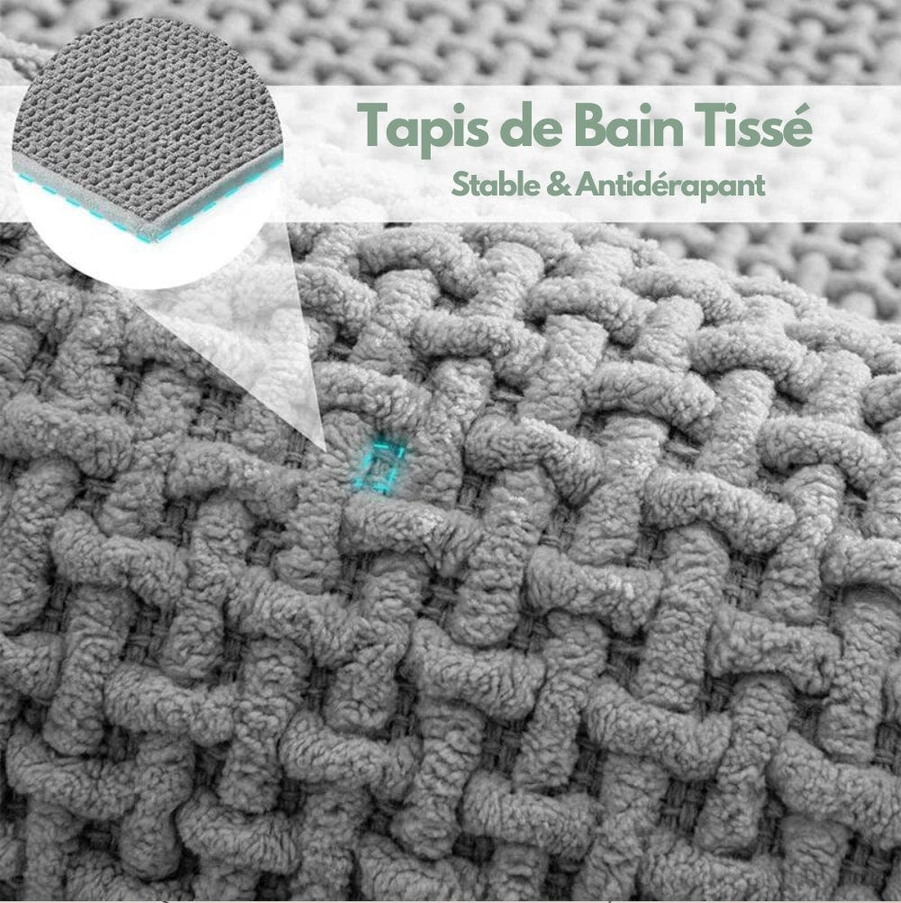 Textured bath mat with non-slip backing for stability and safety in bathroom.