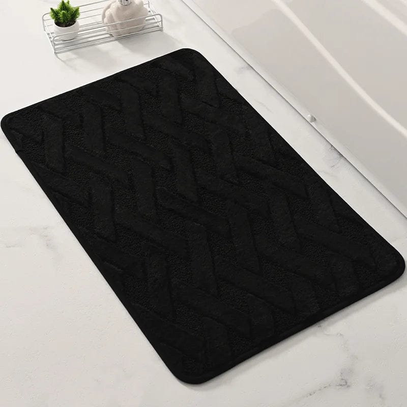 Black geometric pattern bath mat for modern bathroom.