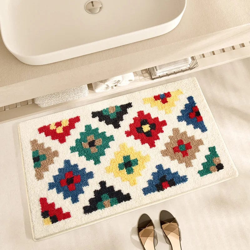 Geometric print bath mat with colorful tribal patterns for modern bathroom decor.