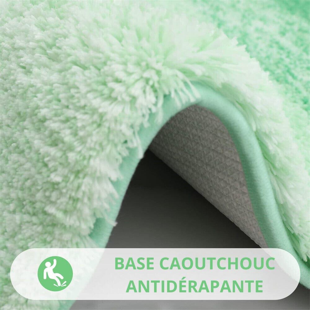 Green white fluffy bath mat with non-slip rubber backing for safety.