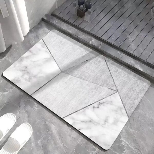 Grey and white patterned bath mat with geometric marble design for modern bathroom.