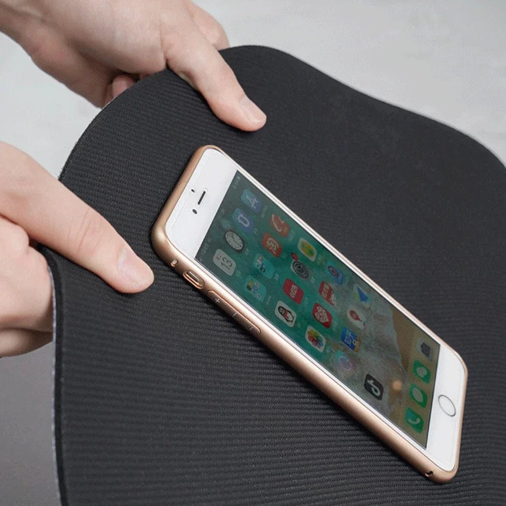 Grey textured bath mat with phone for scale, non-slip bathroom comfort.