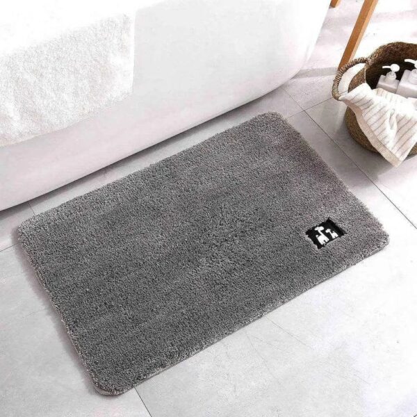 Grey non-slip bath mat with plush texture for bathroom safety and comfort.