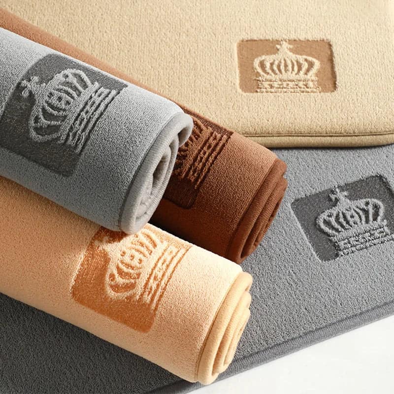 Halfmoon Bath Mat with Crown Embroidery in Multiple Colors.