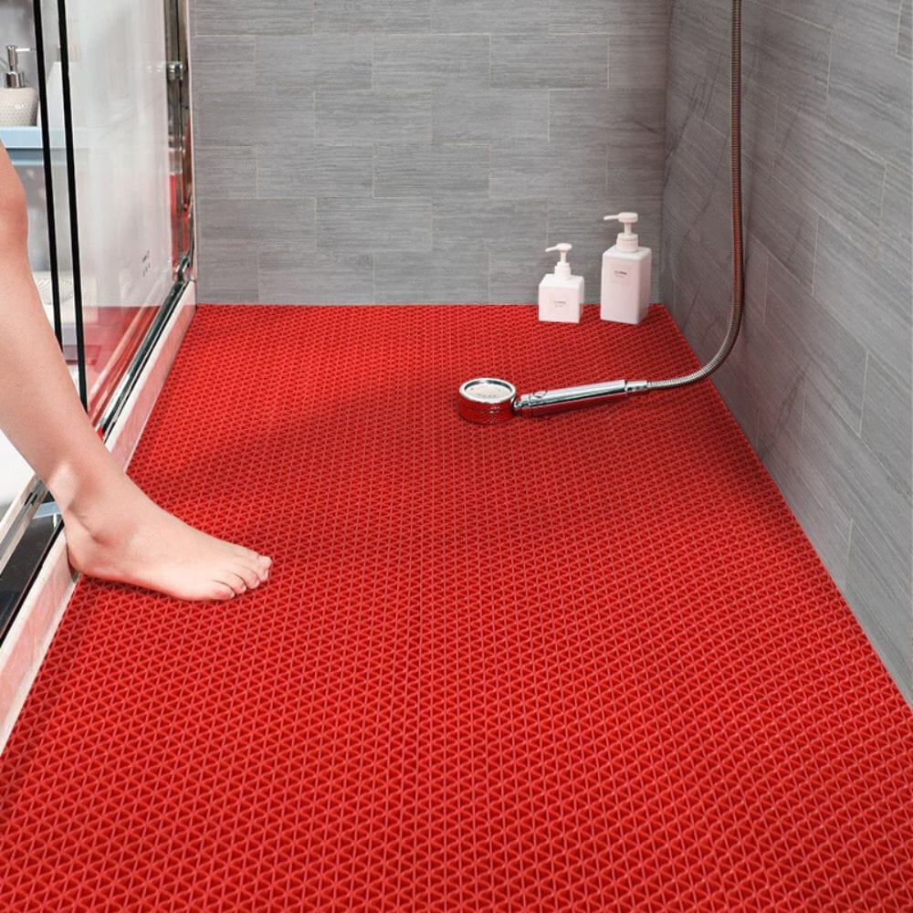 Red non-slip shower bath mat for safety and comfort.