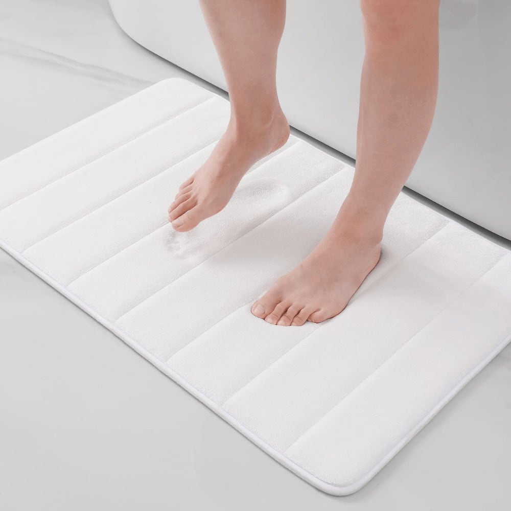 Large fluffy white bath mat with striped texture for comfort and style.