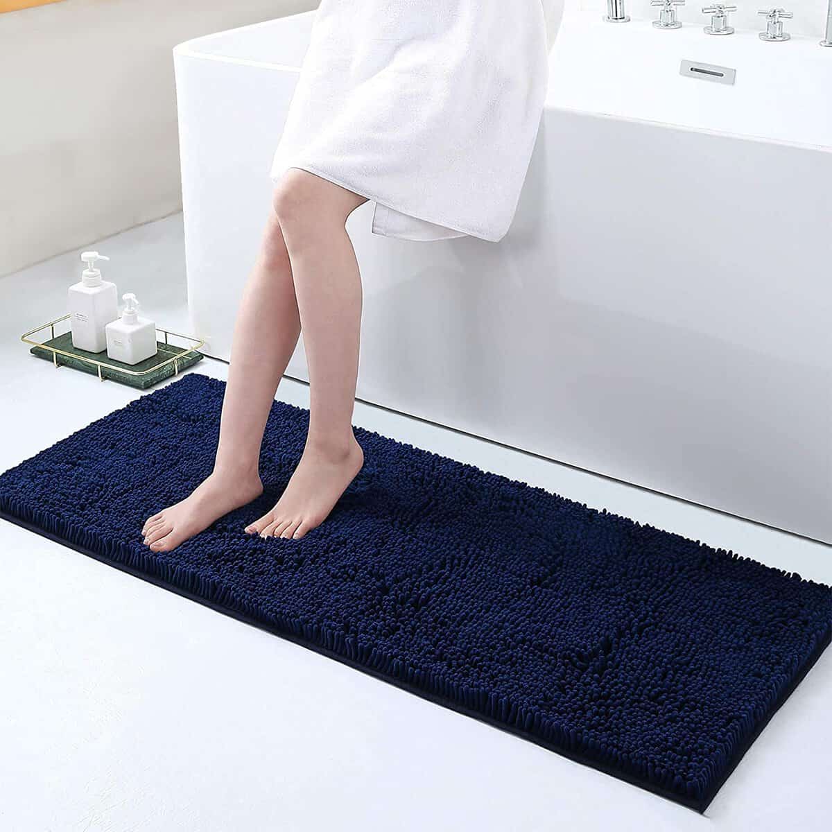 Large navy blue non-slip bath mat for bathroom safety and comfort.