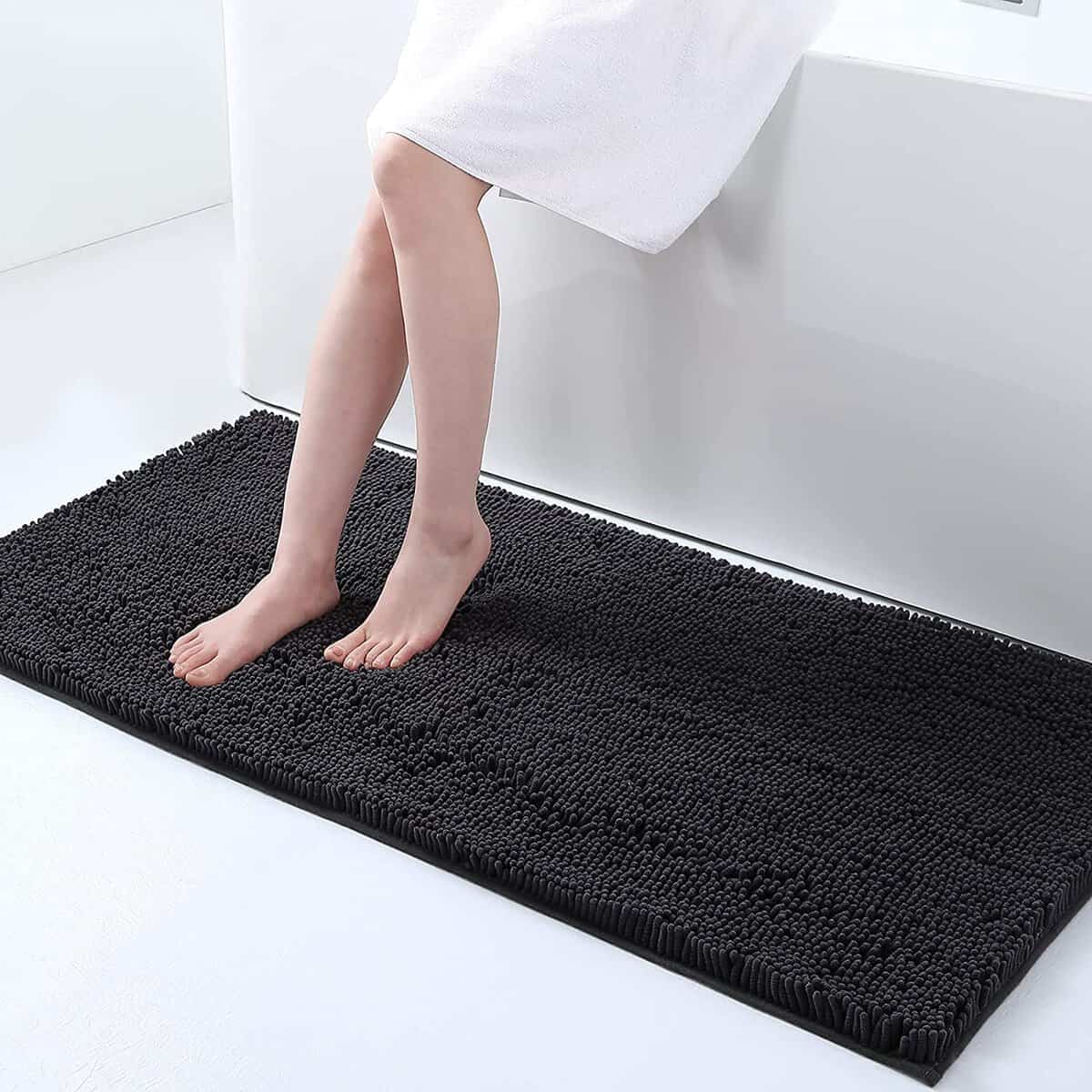 Large non-slip black bath mat for bathroom safety and comfort.