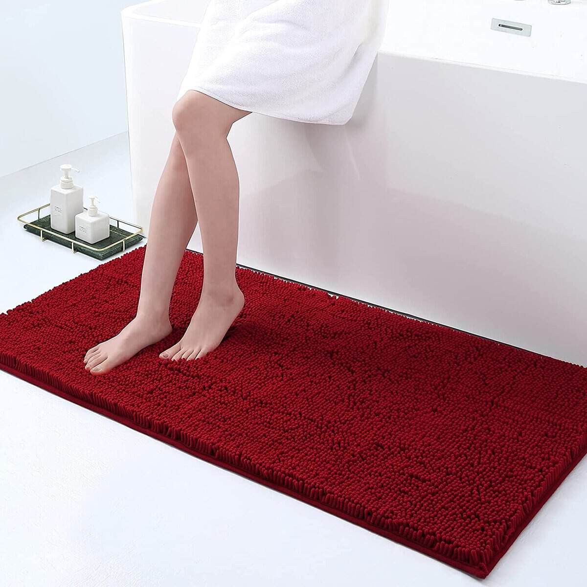 Large non-slip bath mat in red, cozy and absorbent for bathroom safety.
