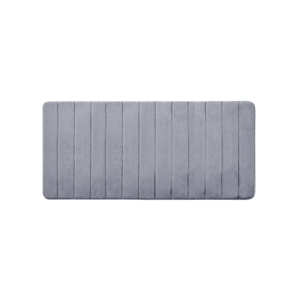 Large thick grey bath mat with vertical ribbed texture for comfort and grip.