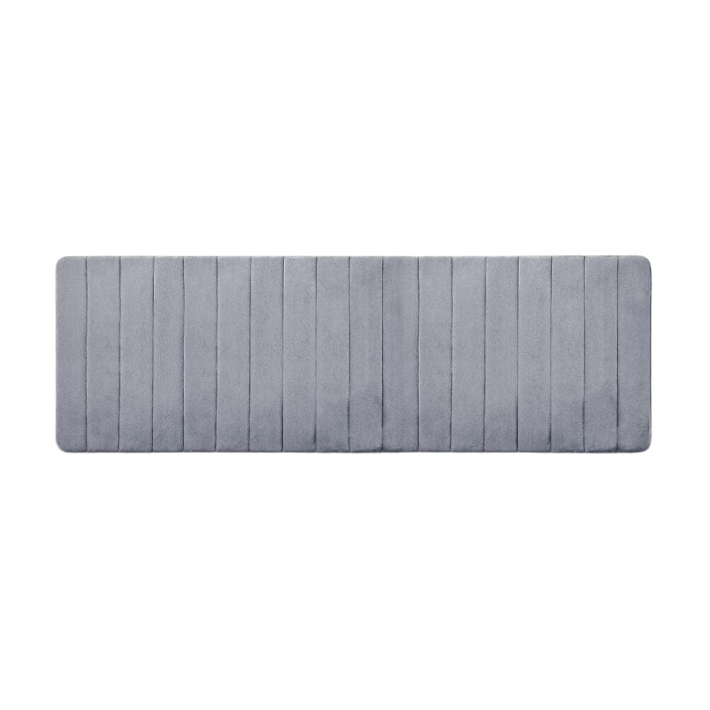 Large thick grey bath mat with vertical stripes for bathroom comfort.