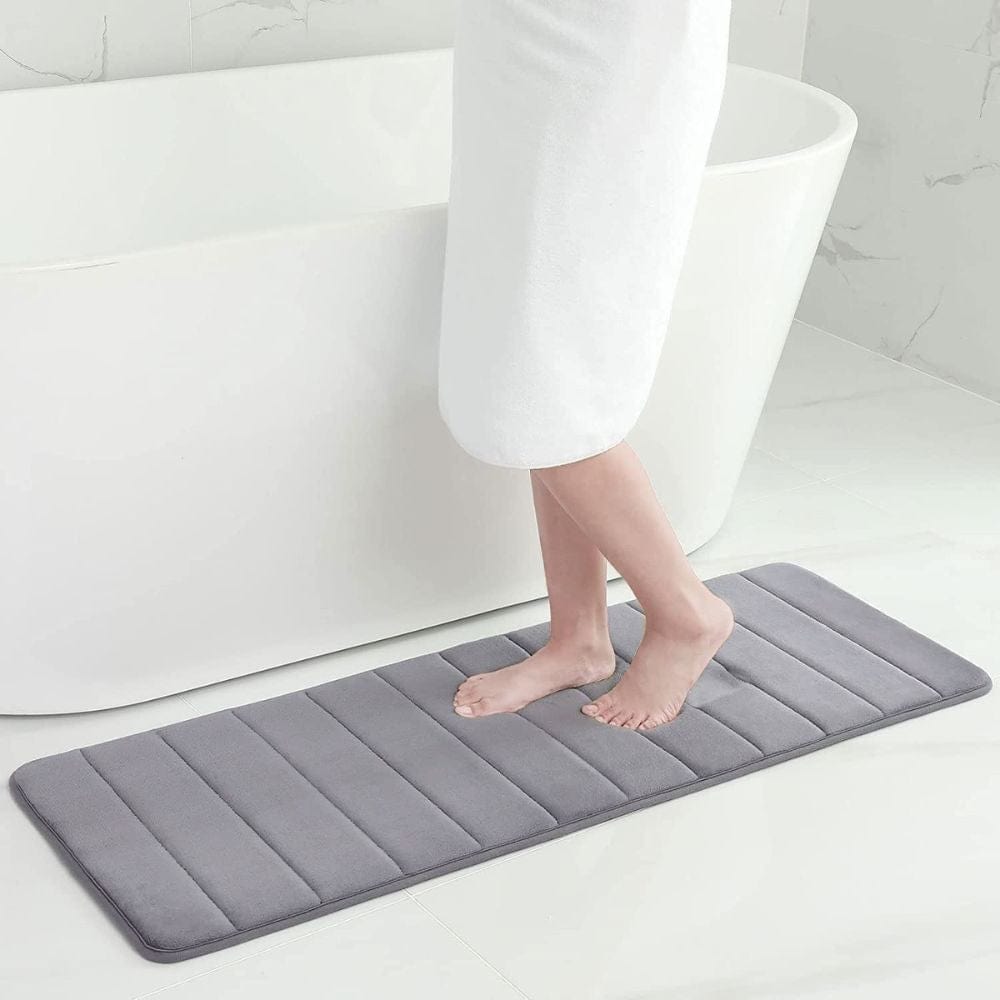 Large thick grey bath mat with ribbed texture for comfort and non-slip bathroom use.