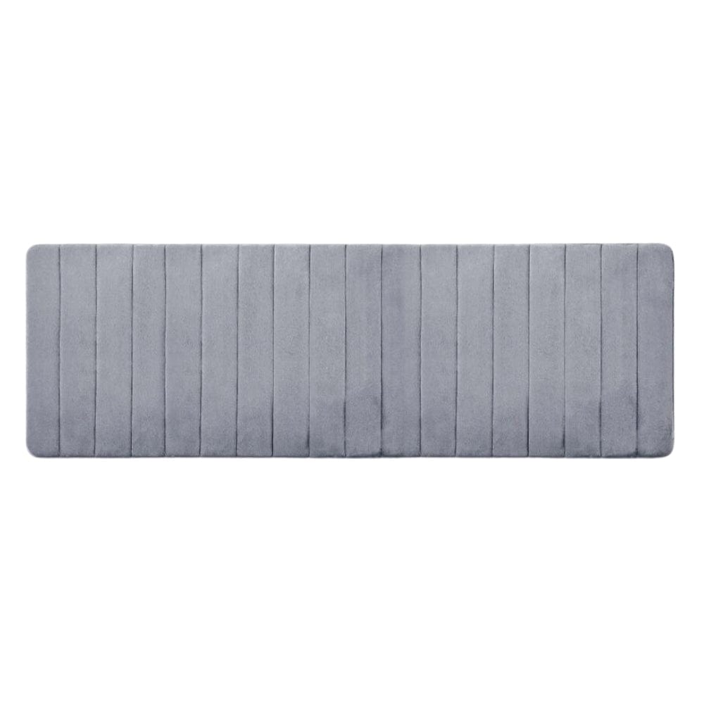 Large thick grey bath mat with vertical ribbed texture for comfort and grip.