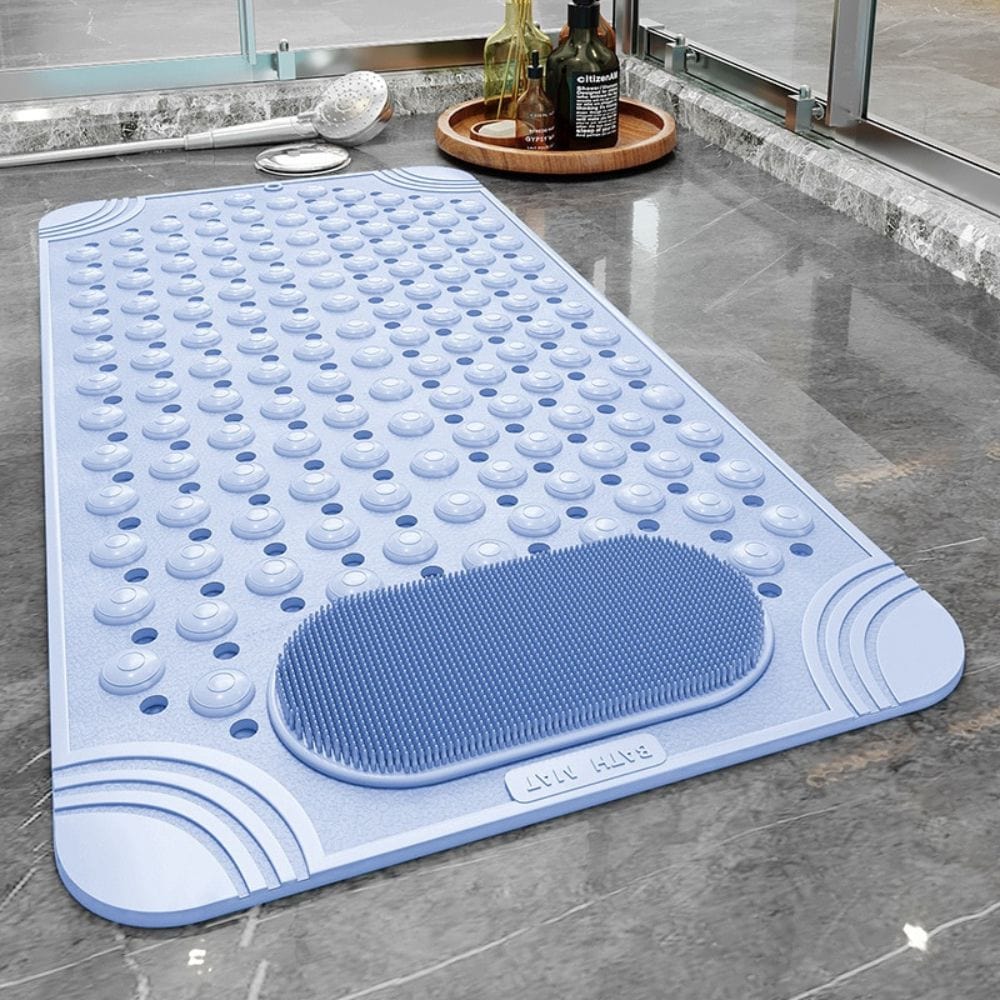 Long rectangular bath mat with massage bumps and foot scrubber.