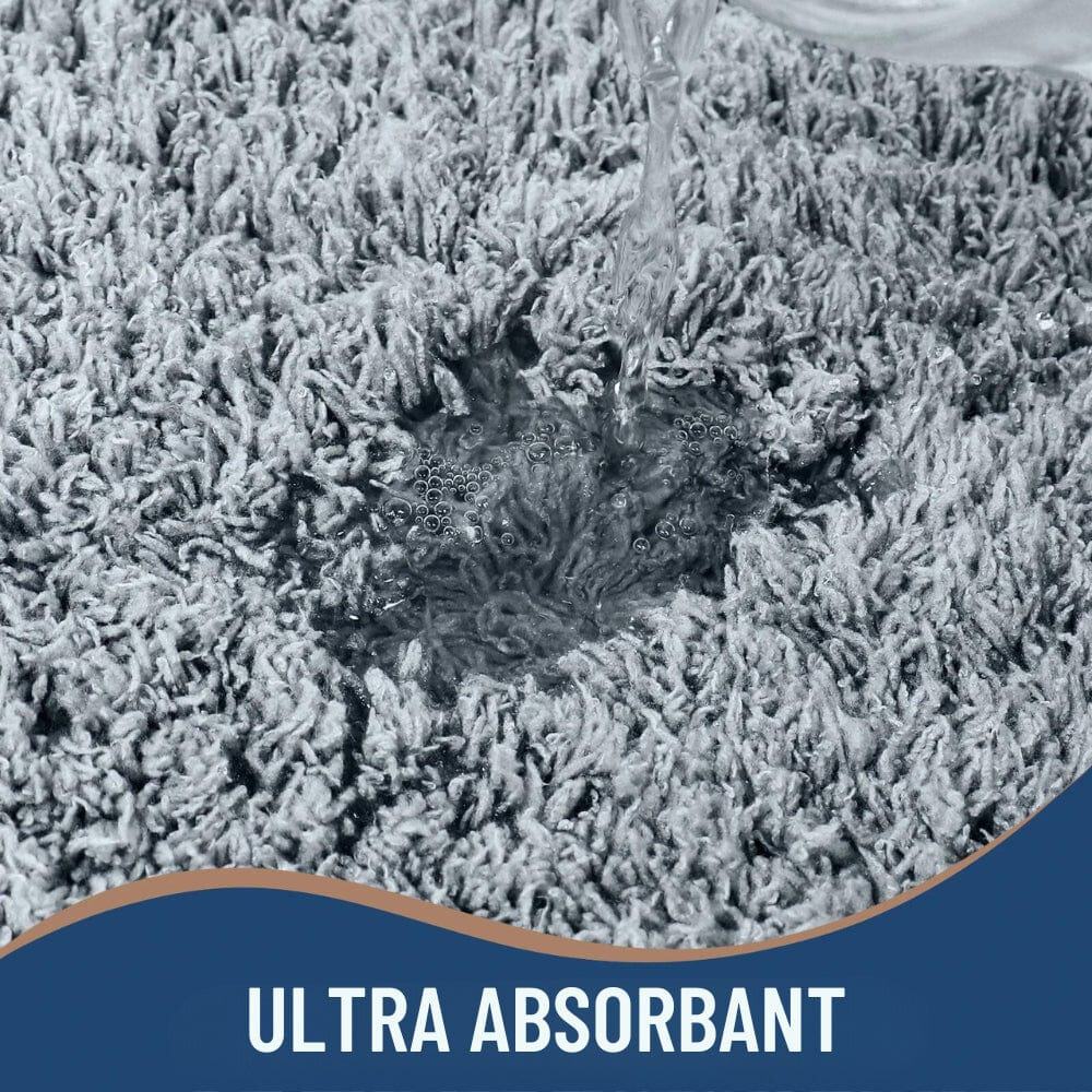 Microfiber bath mat absorbing water quickly and efficiently.