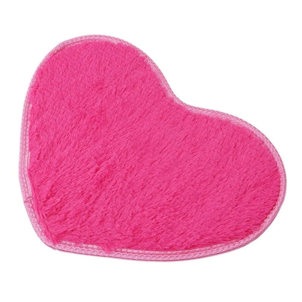 Pink heart-shaped microfiber chenille bath mat for bathroom.