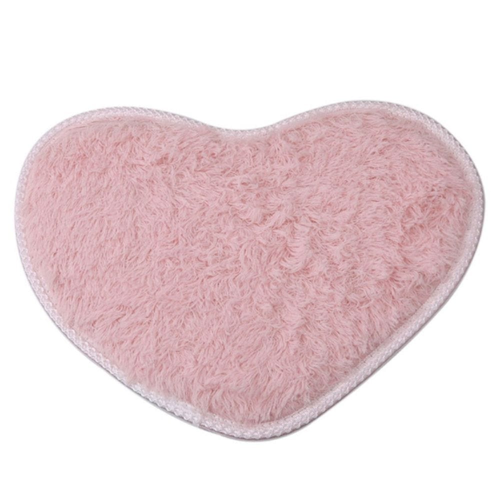 Pink heart-shaped microfiber chenille bath mat for bathroom comfort.