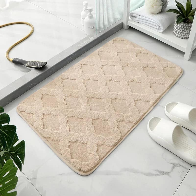Microfibre bath mat with diamond pattern for bathroom comfort and style.