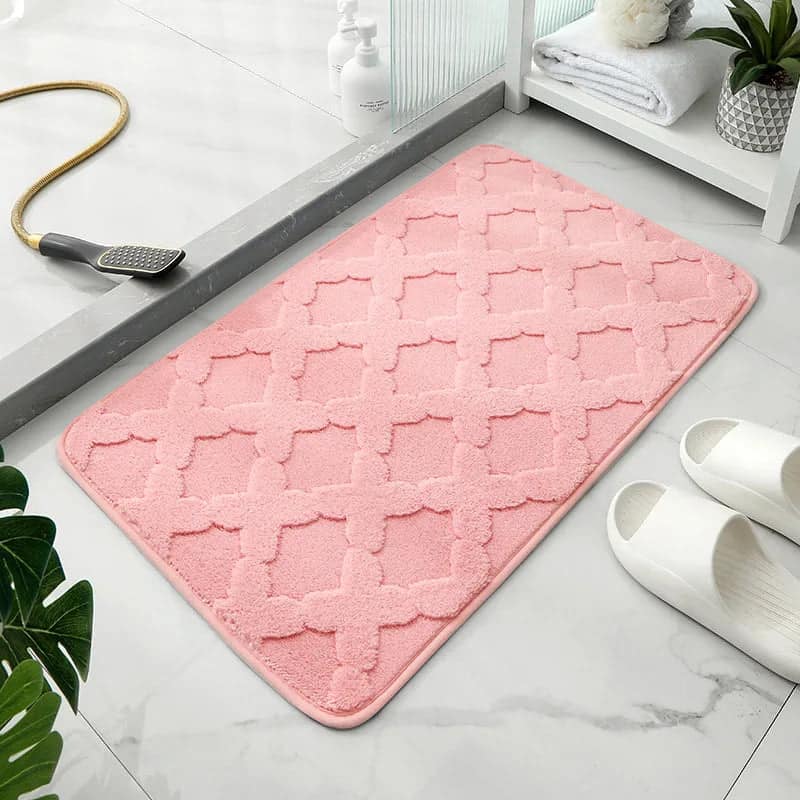 Pink microfibre bath mat with geometric pattern for bathroom.