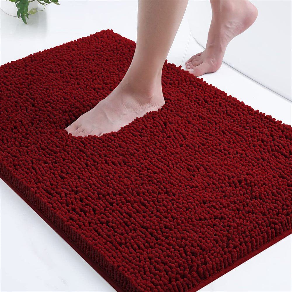Red microfiber bath mat with textured surface for comfort and grip.