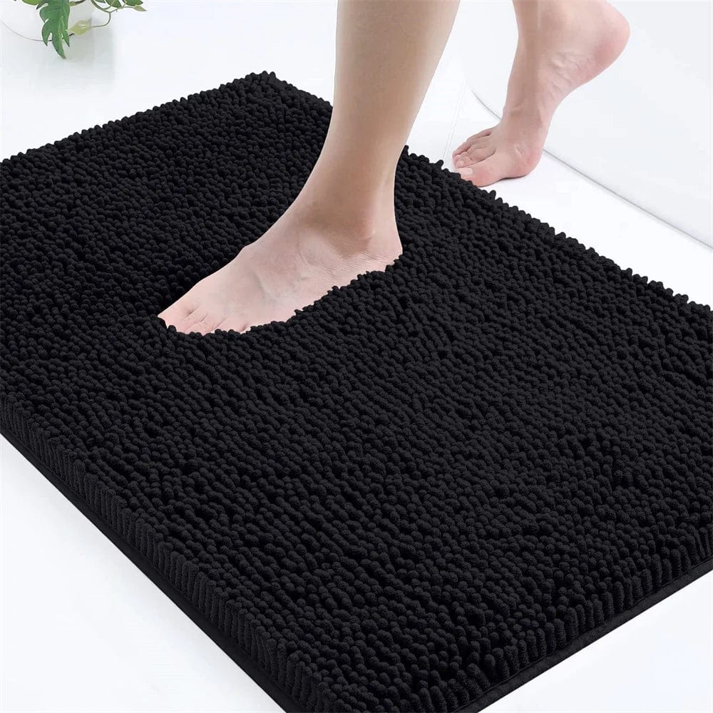 Black mini microfiber bath mat with textured surface for bathroom comfort.