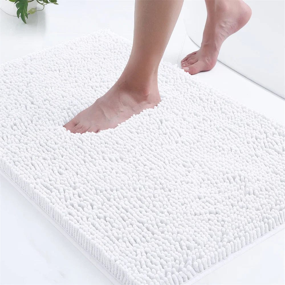 White mini microfiber bath mat with soft texture, ideal for bathroom comfort and moisture absorption.