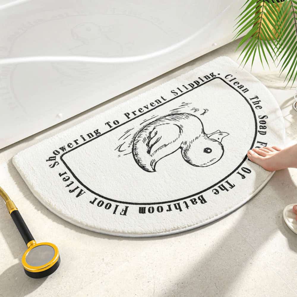 Moon shaped bath mat with squirrel design for bathroom safety and style.