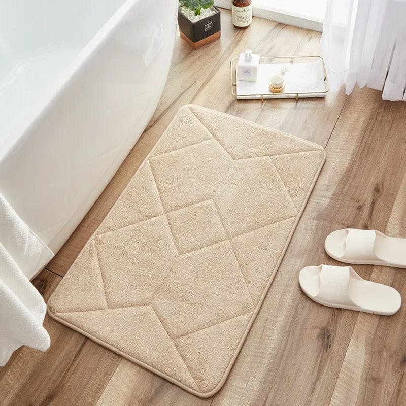 Non-slip bath mat with geometric pattern for bathroom safety.