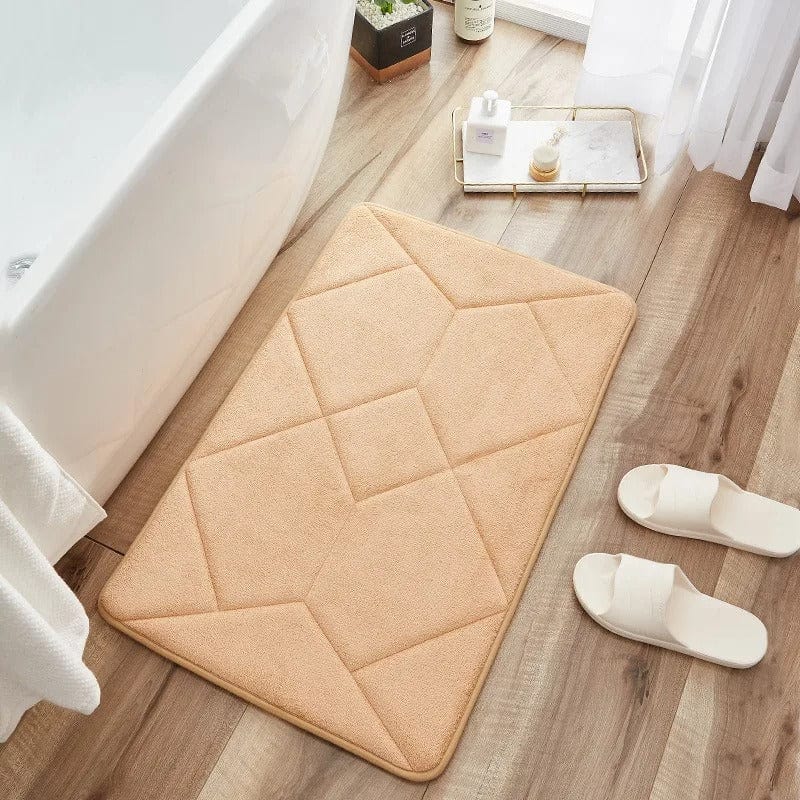 Non-slip bath mat with geometric stitching for bathroom safety.