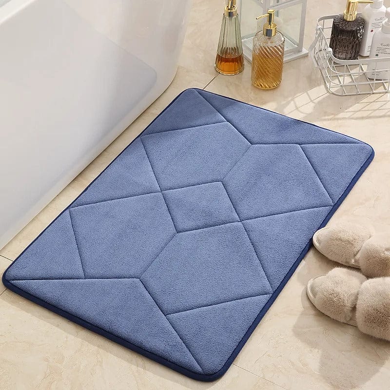 Blue quilted non-slip bath mat for bathroom safety.