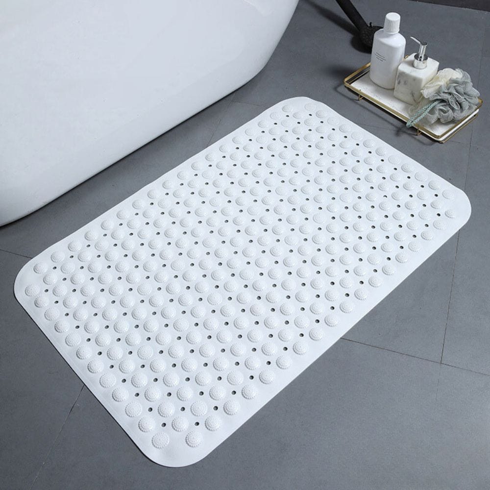 White non-slip bath mat with textured dots for safety in bathroom.