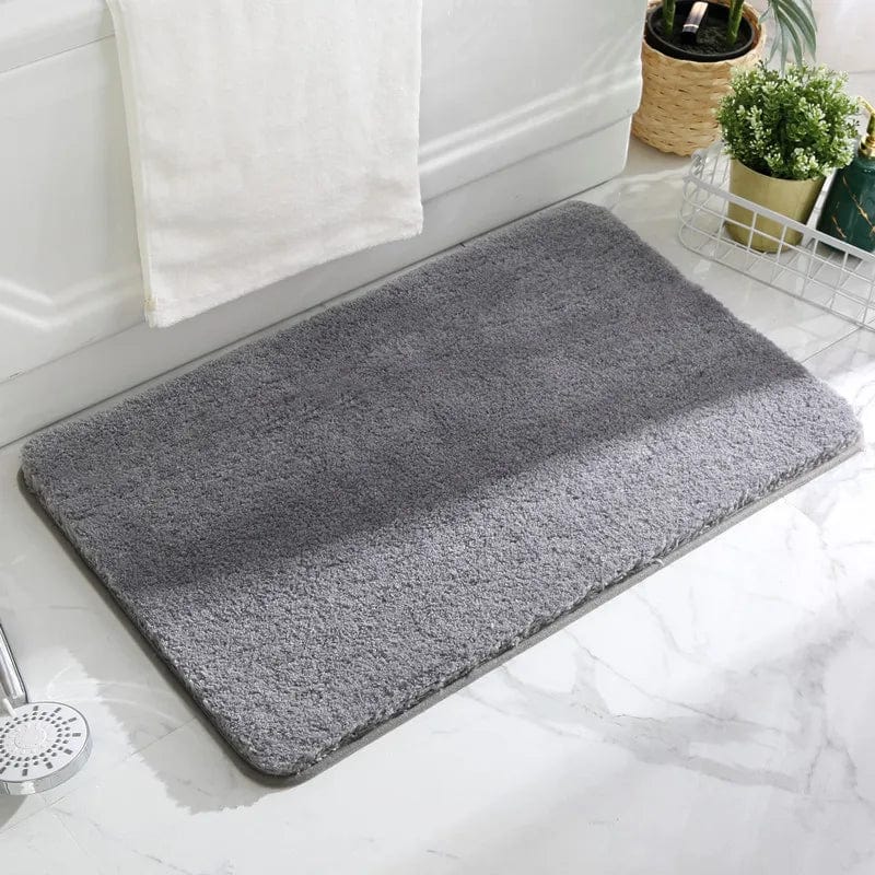 Grey non-slip bath mat for bathroom safety and comfort.