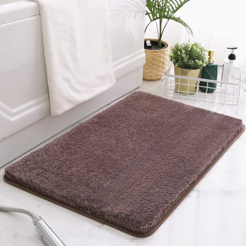 Brown non-slip bath mat for bathroom safety and comfort.