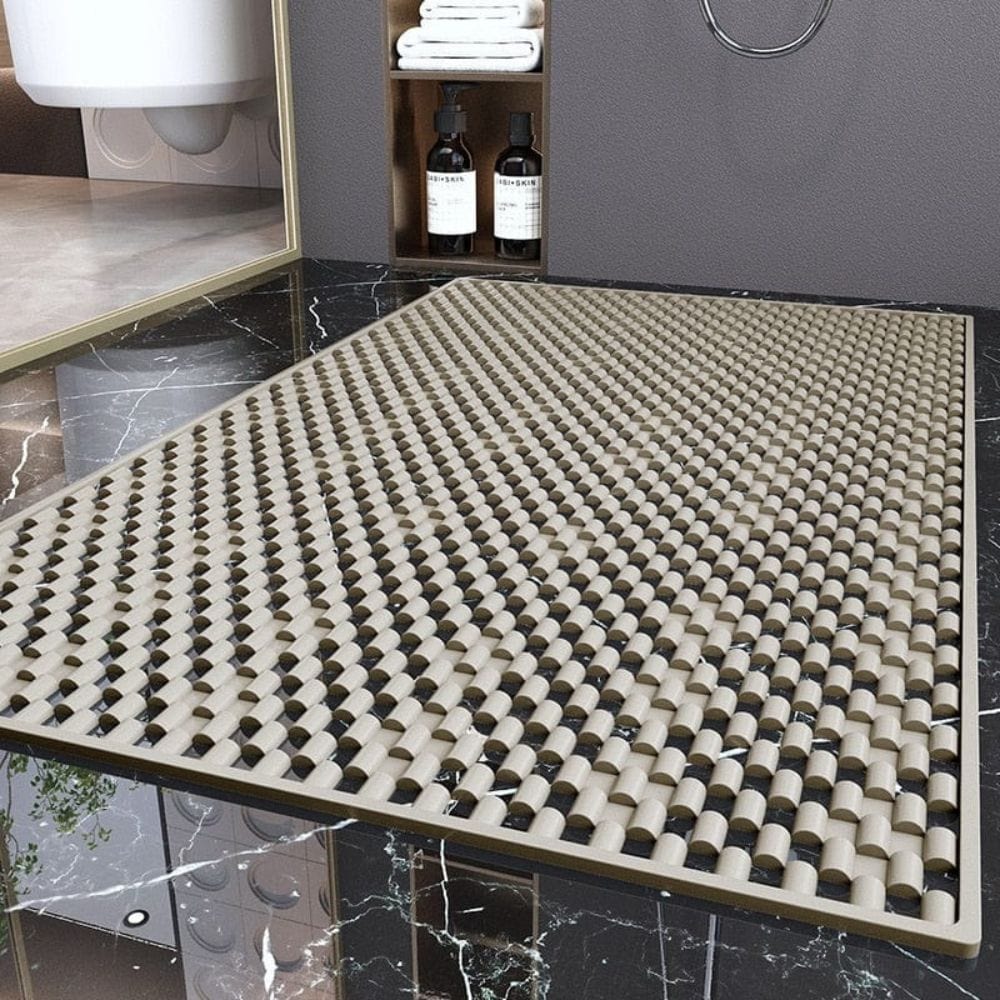 Non-slip shower bath mat with textured grip for safety in bathroom.