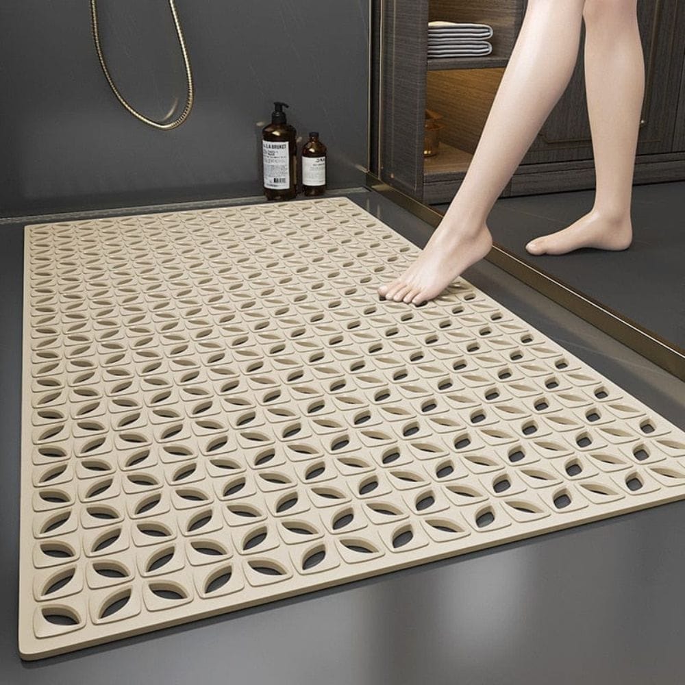 Non-slip shower bath mat with textured design for safety and drainage.