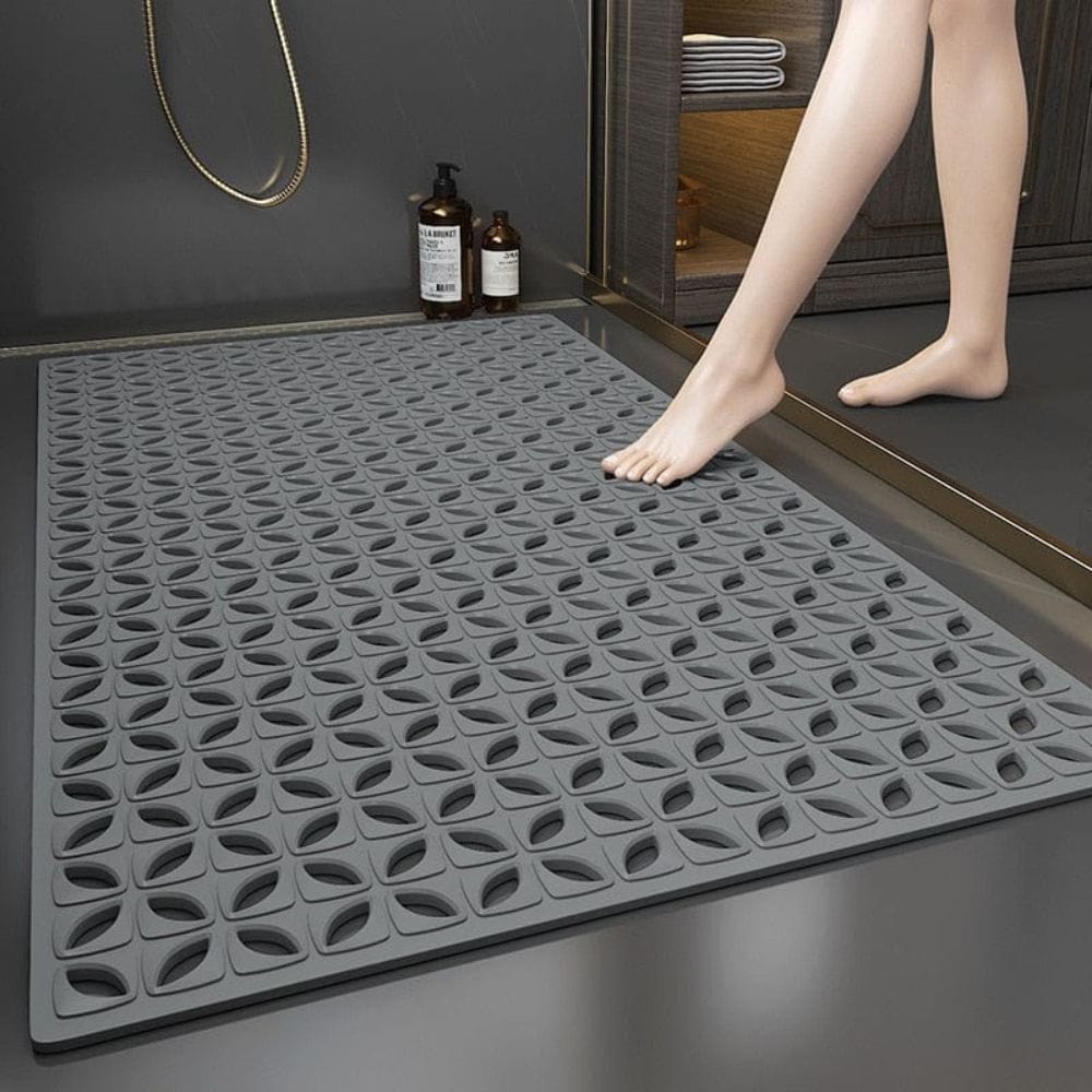 Non-slip shower bath mat with textured design for safety and drainage.