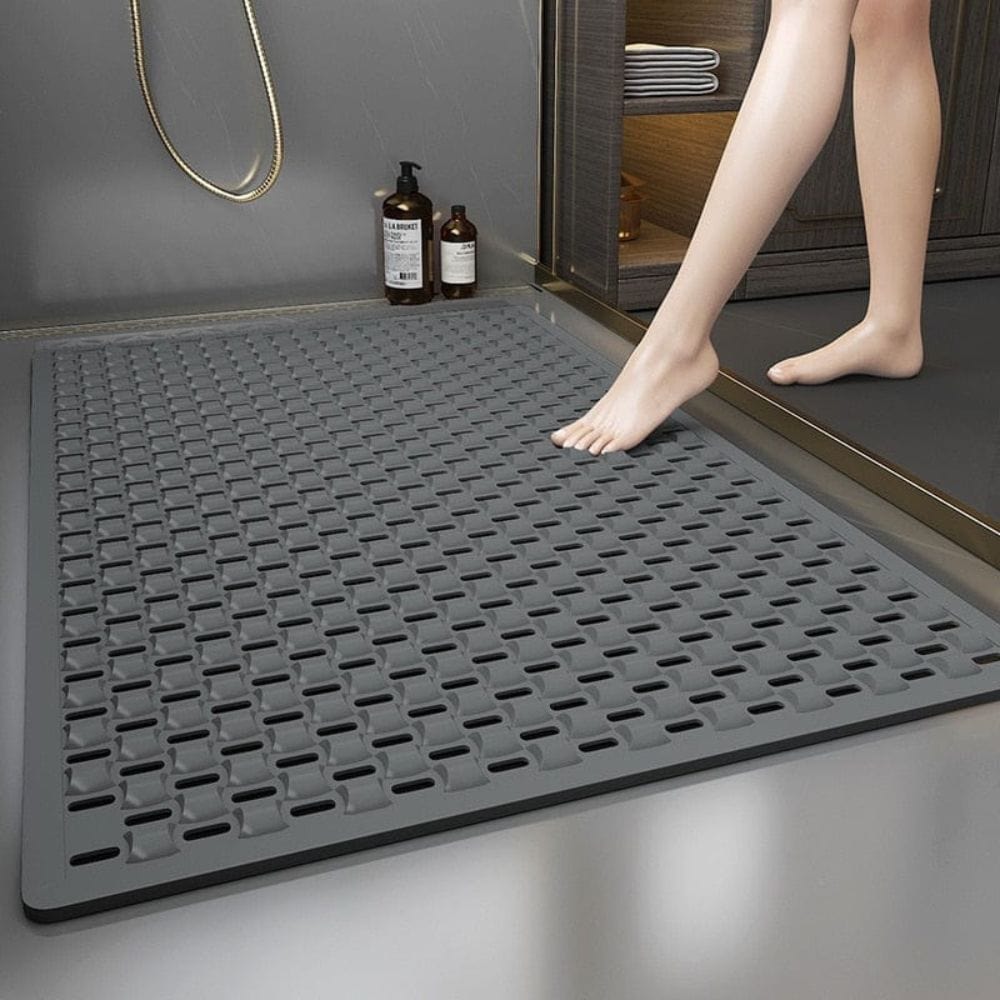 Non-slip shower bath mat with textured grip for safety in wet bathroom.