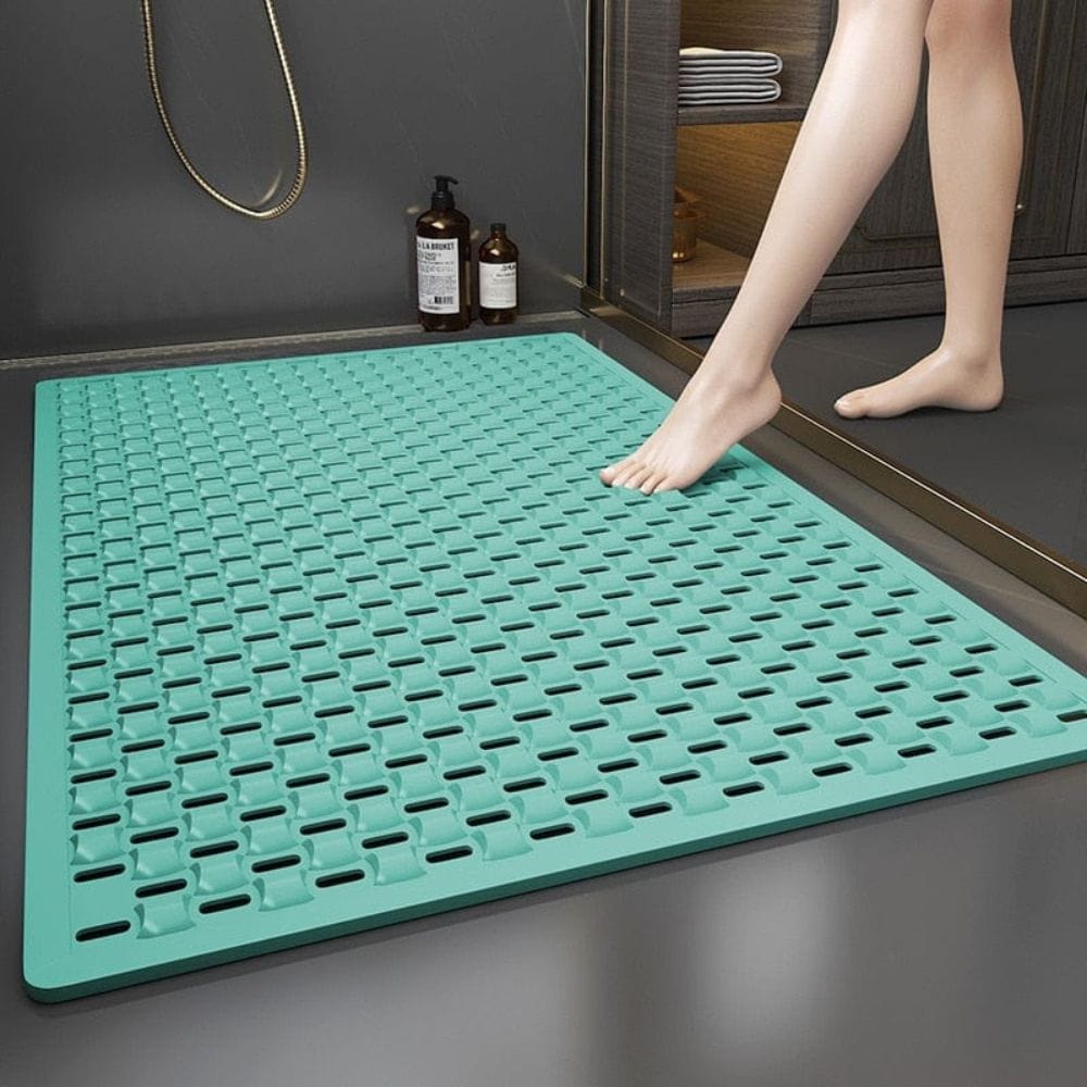 Non-slip shower bath mat in teal with textured grip design for safety.