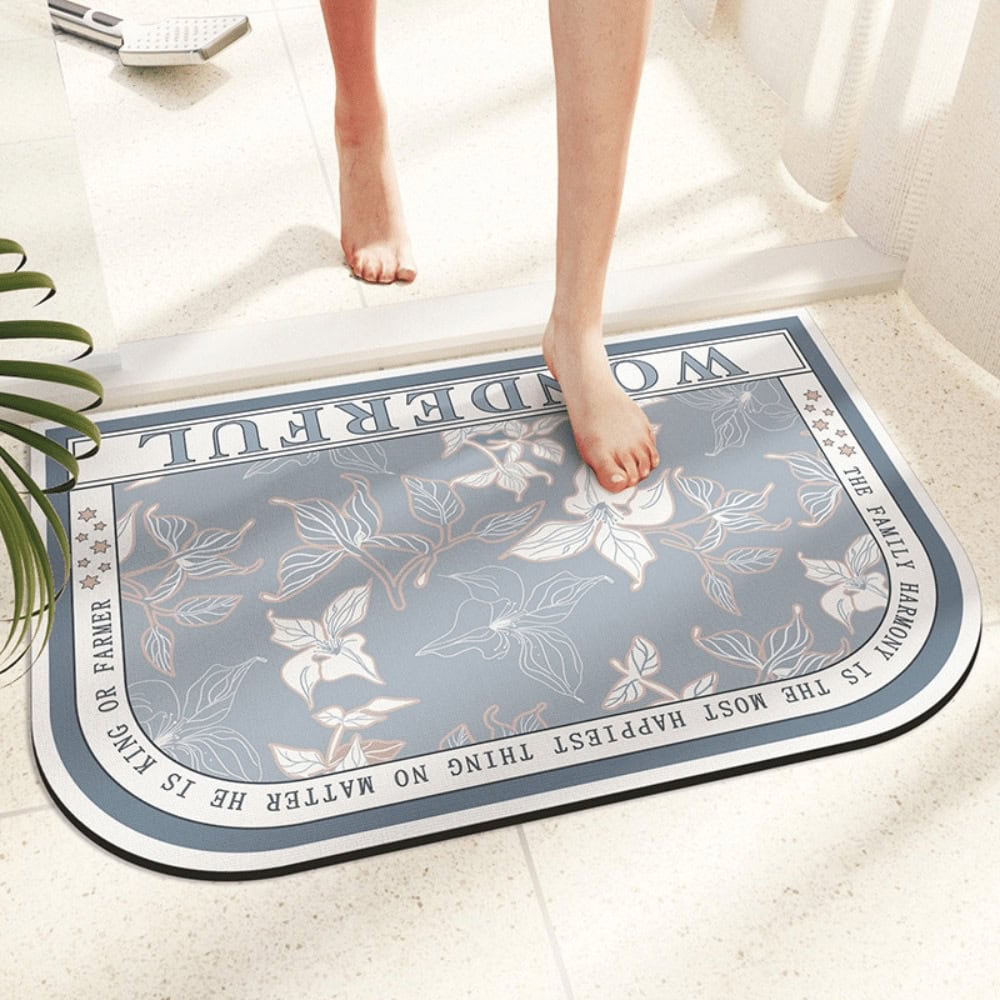 Orchid pattern bath mat with inspirational quote, cozy bathroom decor.