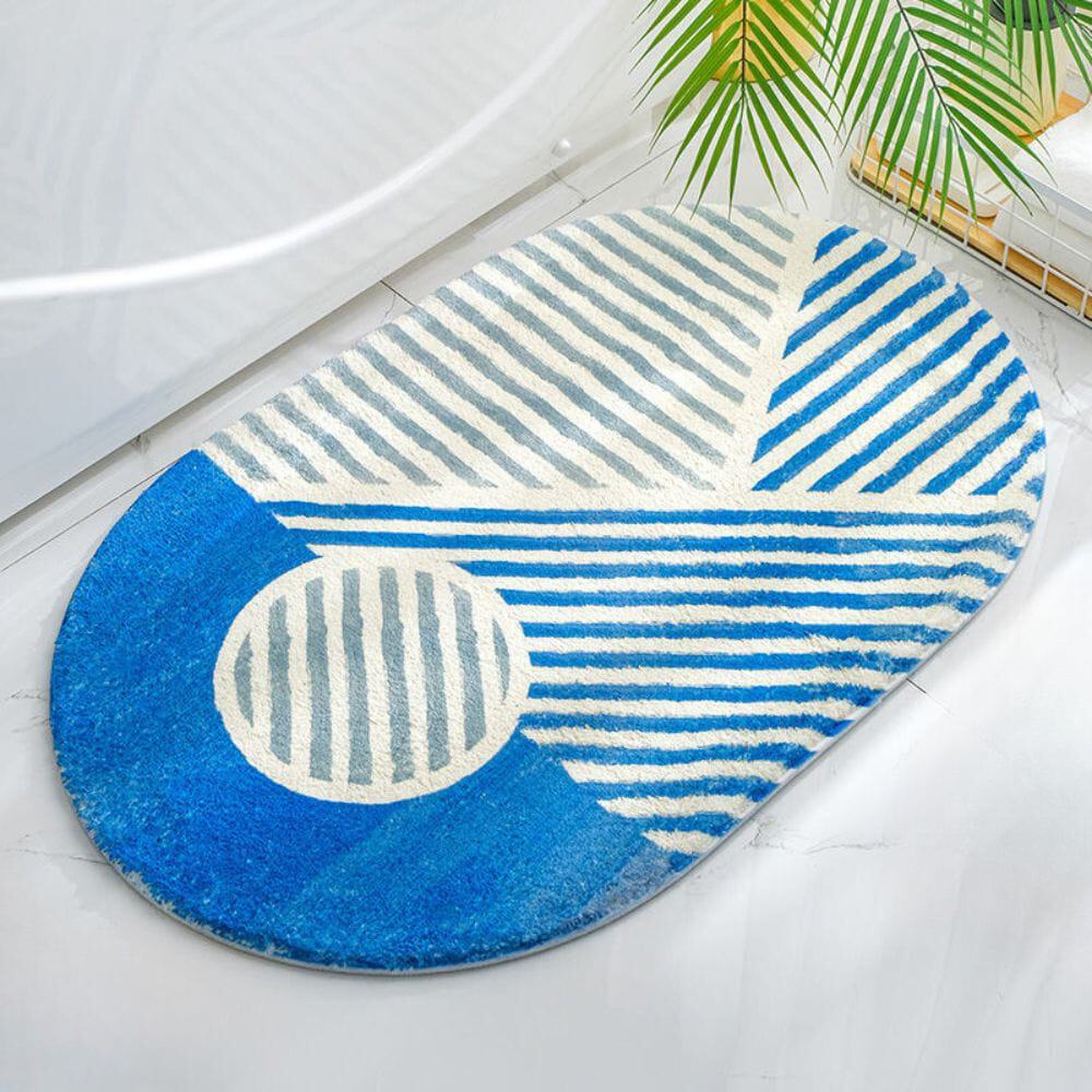 Oval blue and white striped bath mat for bathroom.