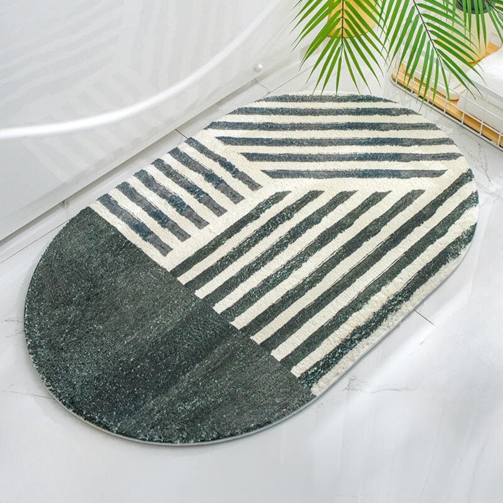 Oval striped bath mat with geometric design for modern bathroom.