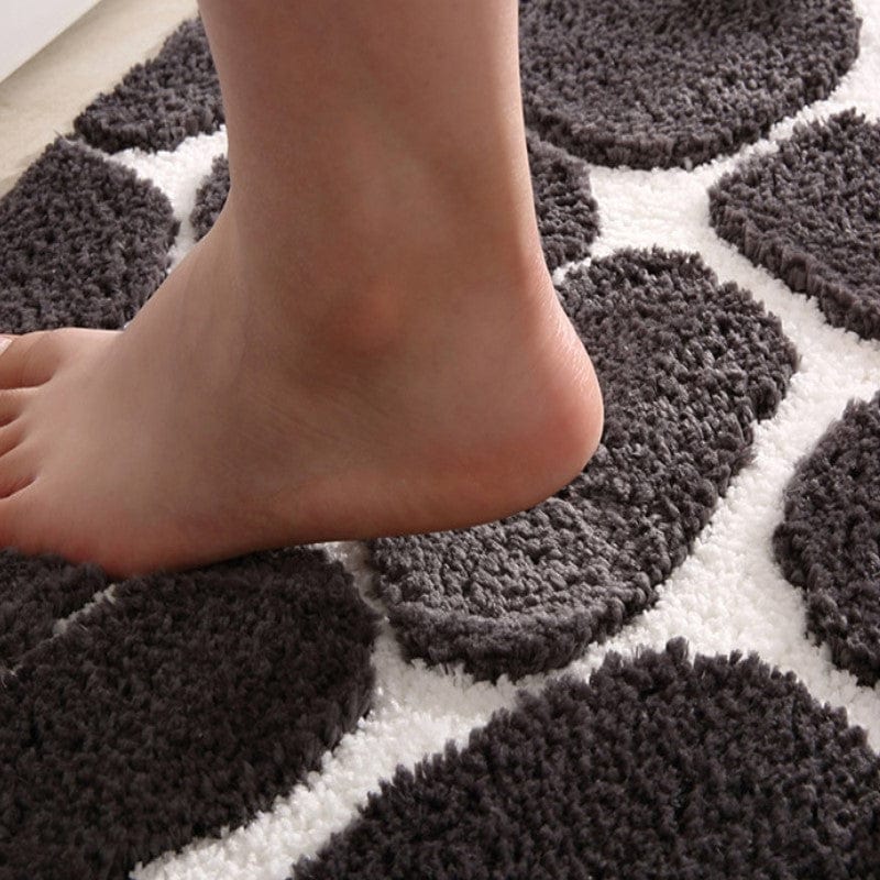Pebble pattern memory foam bath mat for comfort and style.