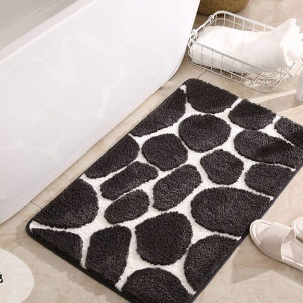 Pebble pattern memory foam bath mat for bathroom comfort and style.