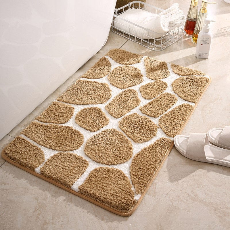 Pebble pattern memory foam bath mat for comfort and style.