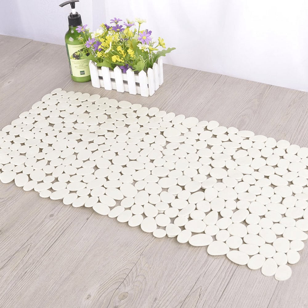 White plastic non-slip bath mat with pebble design for bathroom safety.