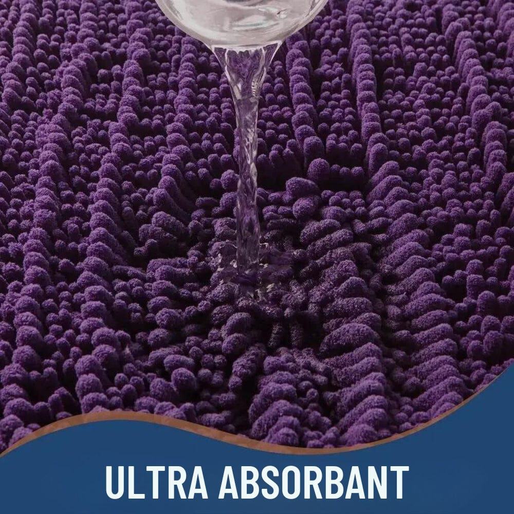 Purple ultra absorbent bath mat with water being poured on it.