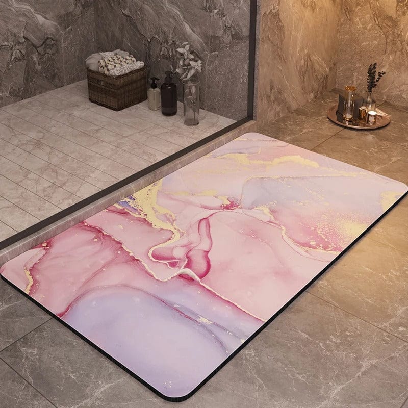Pink and gold marble bath mat with non-slip backing for luxury bathroom.